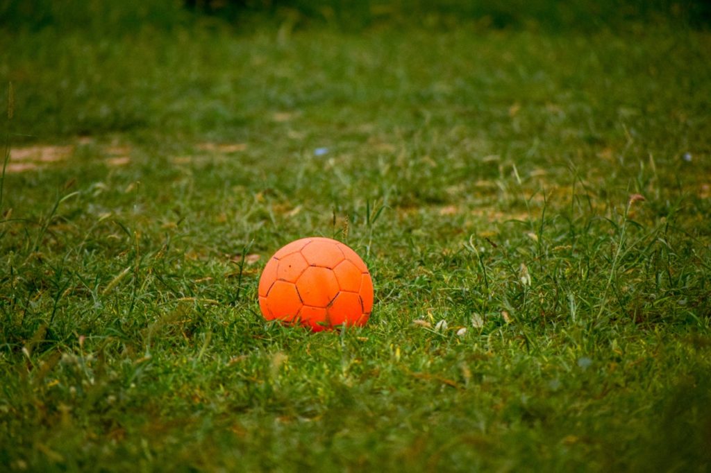 Orange ball left on football pitch following club dormancy