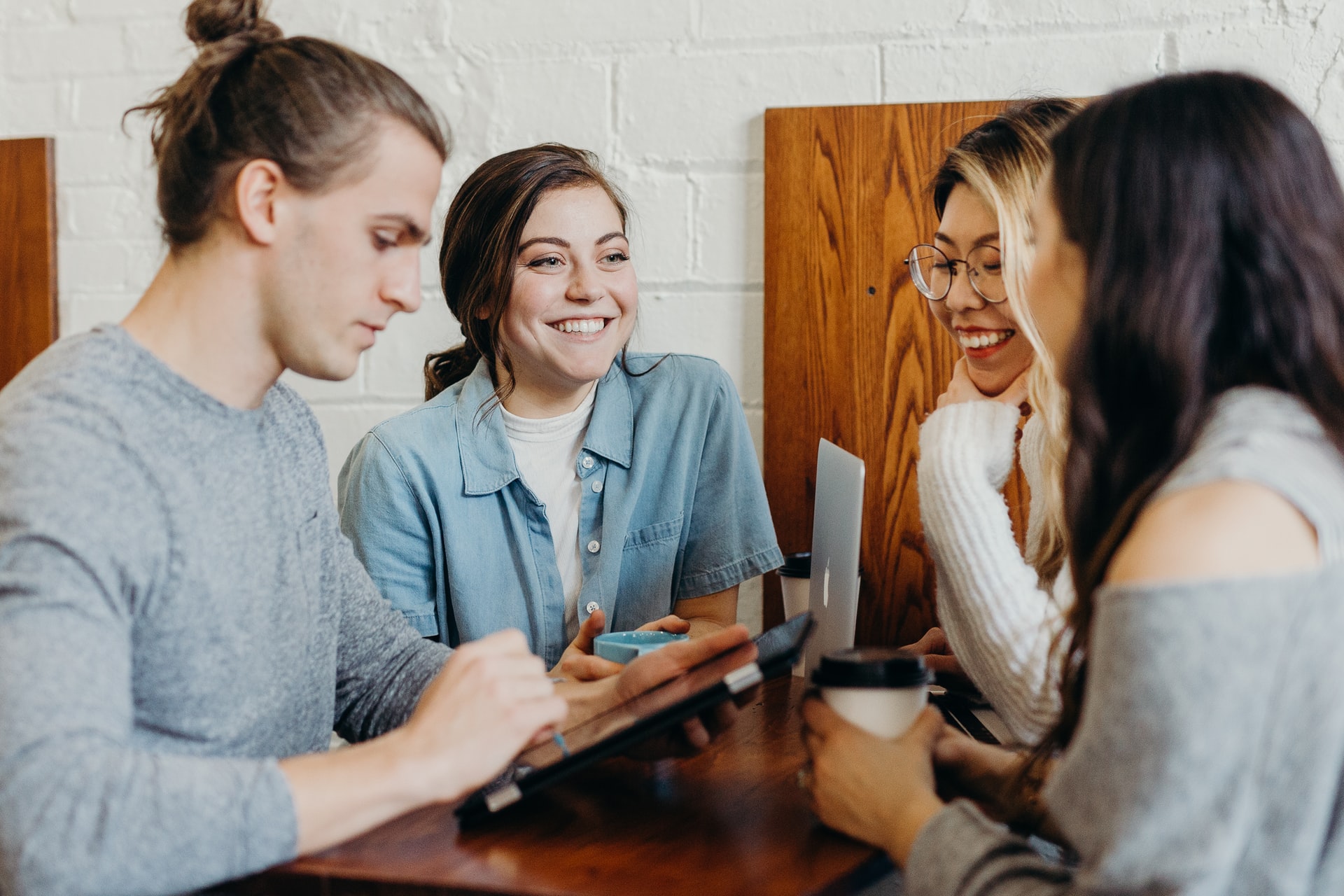 A group of people socialising at a community centre